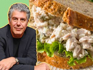 anthony bourdain cut-out next to a photo of chicken salad sandwich