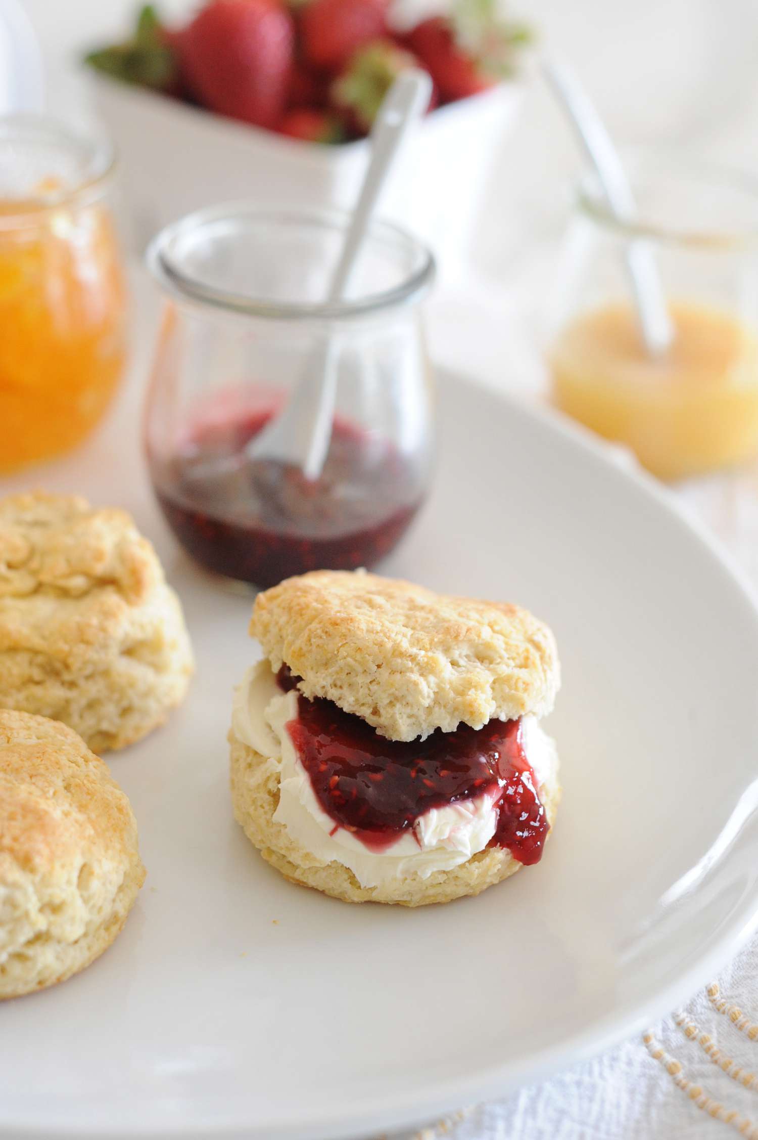 English-Style Scones spread with jam and butter.