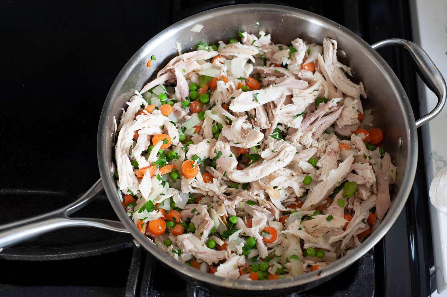 Cook chicken and vegetable filling.