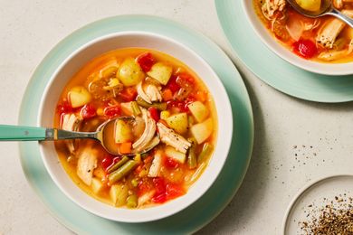 Chicken Vegetable Soup in two bowls with spoons