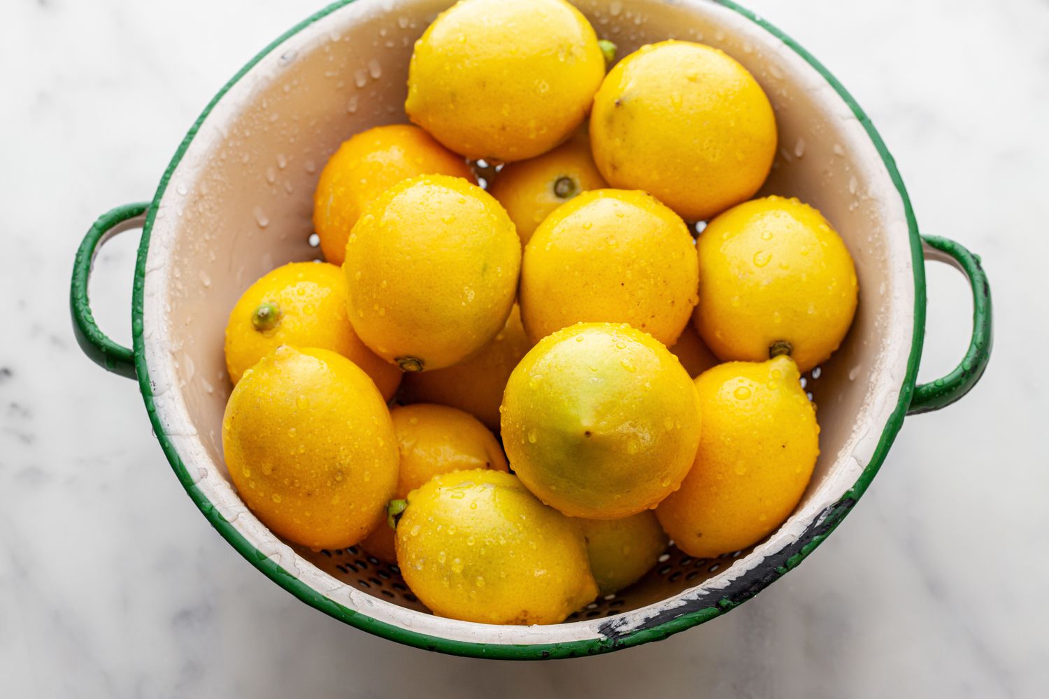 Lemons in a Colander for How to Make Preserved Lemons