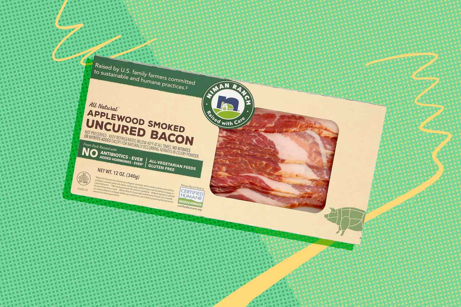 A package of applewood smoked uncured bacon on a green background