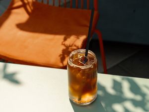 glass of iced coffee with a straw