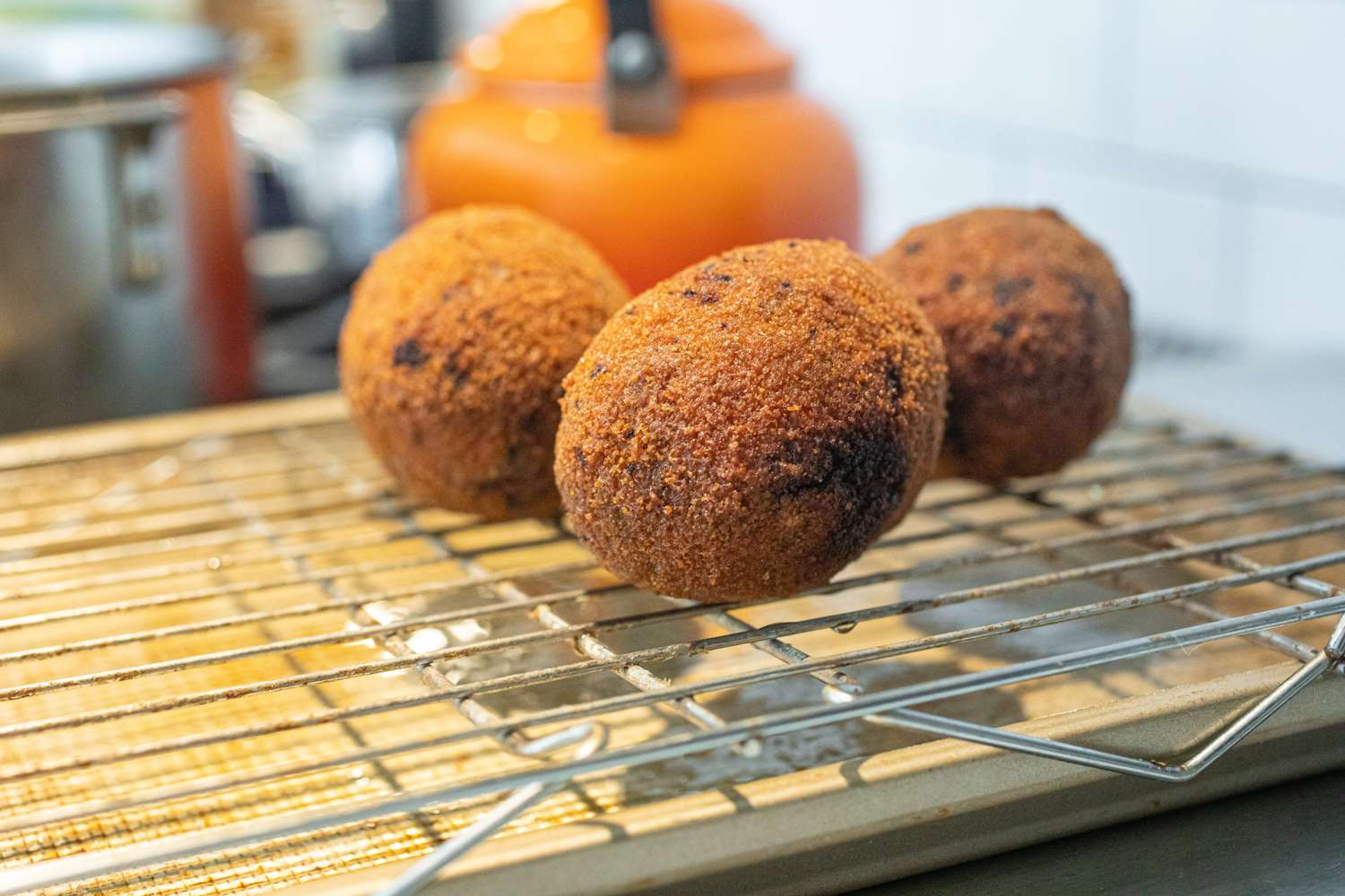 Drain fried Scotch eggs on a wire rack.