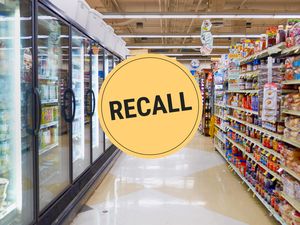 A supermarket aisle showing shelves of products with a Recall notice overlaid