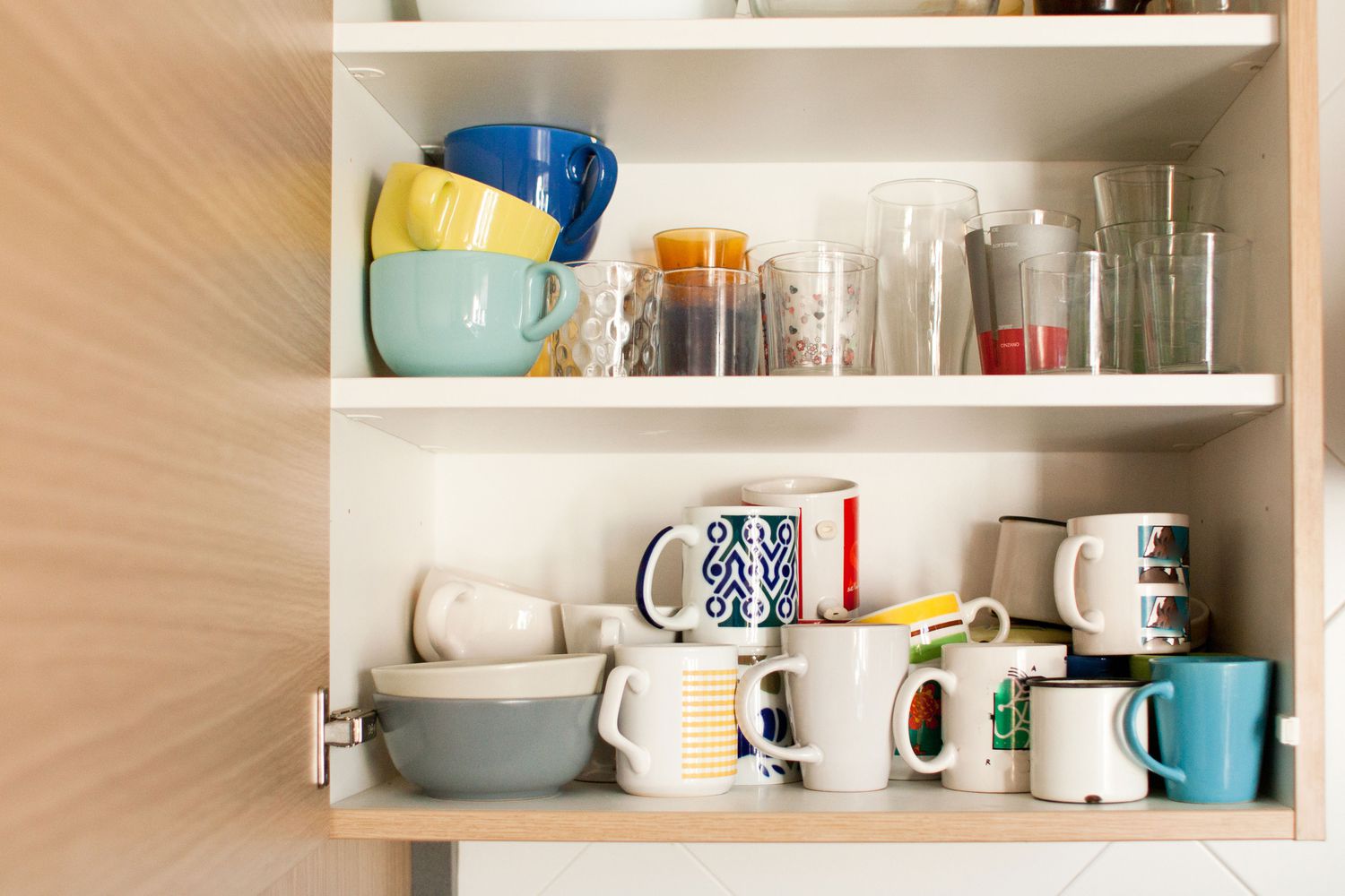 open cabinet with glasses and cups