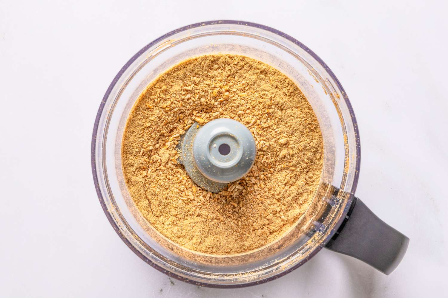 pretzel crumbs in a food processor for pretzel chicken recipe