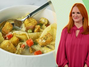 Ree Drummond next to a bowl of creamy tortellini soup with croutons and vegetables
