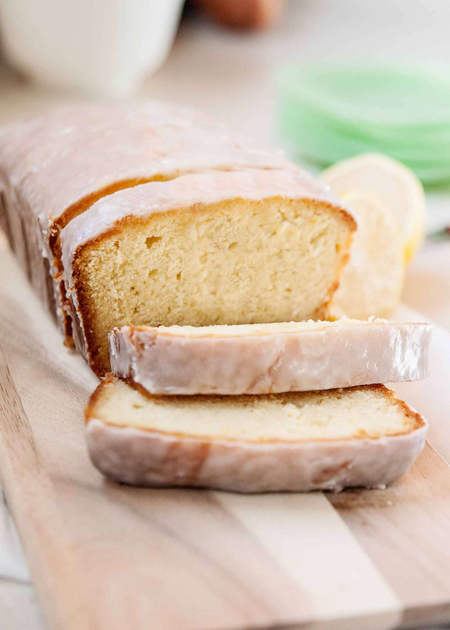 Starbucks Lemon Pound Cake Recipe - sliced pound cake with lemons in the background