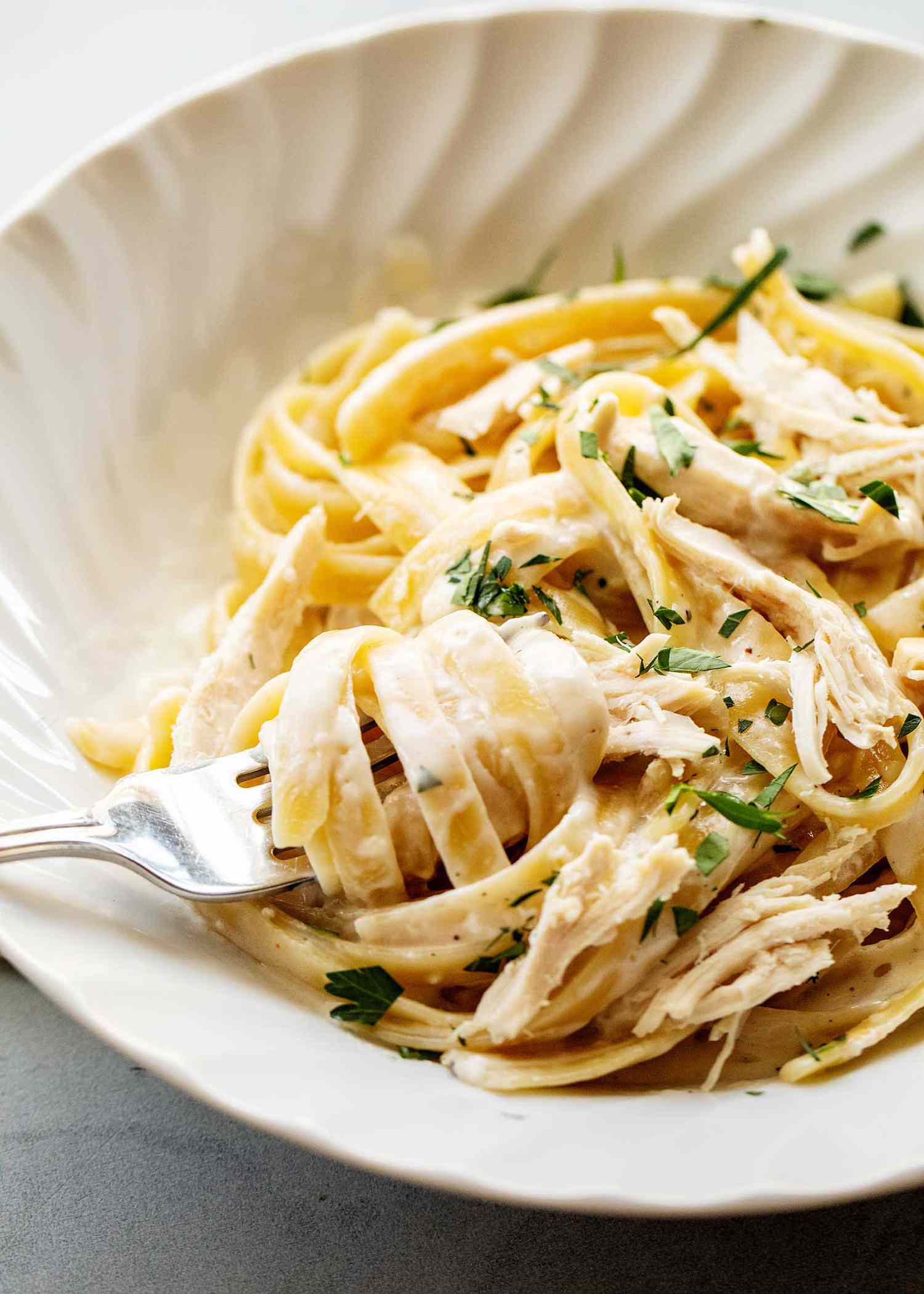 rotisserie chicken alfredo in a bowl