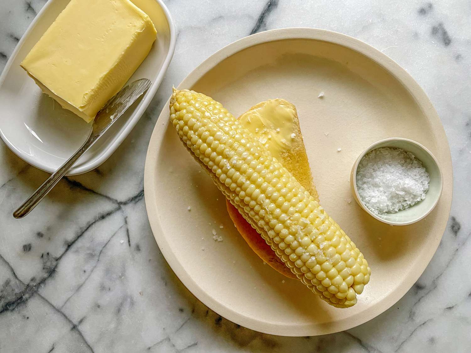 corn cob on buttered bread 