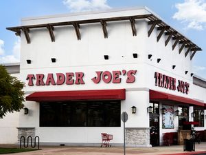 Exterior of a Trader Joe's store with visible signs and entrance