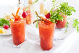 Spicy Bloody Maria Cocktail - two glasses of cocktail with vegetable garnishes