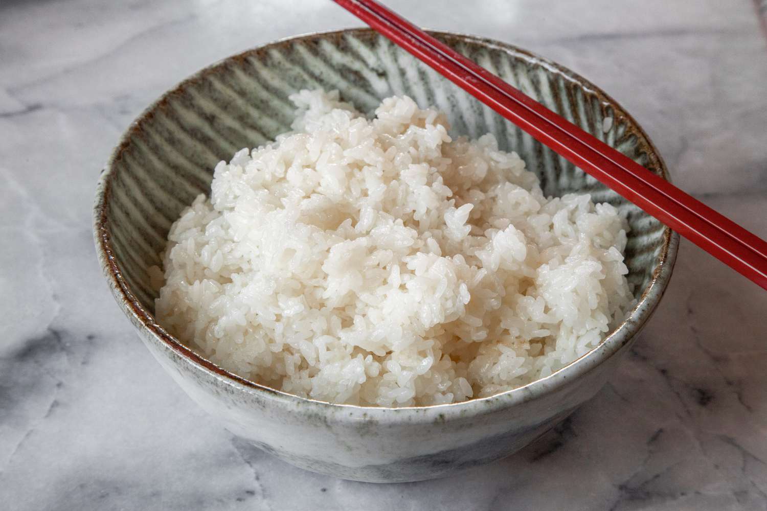 Sushi Rice in a Bowl with Chopsticks