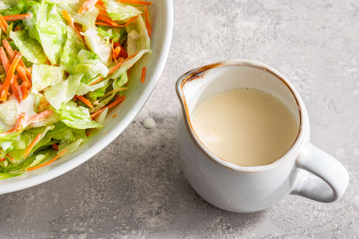 Teriyaki restaurant 3-ingredient dressing in a small white dish next to a salad
