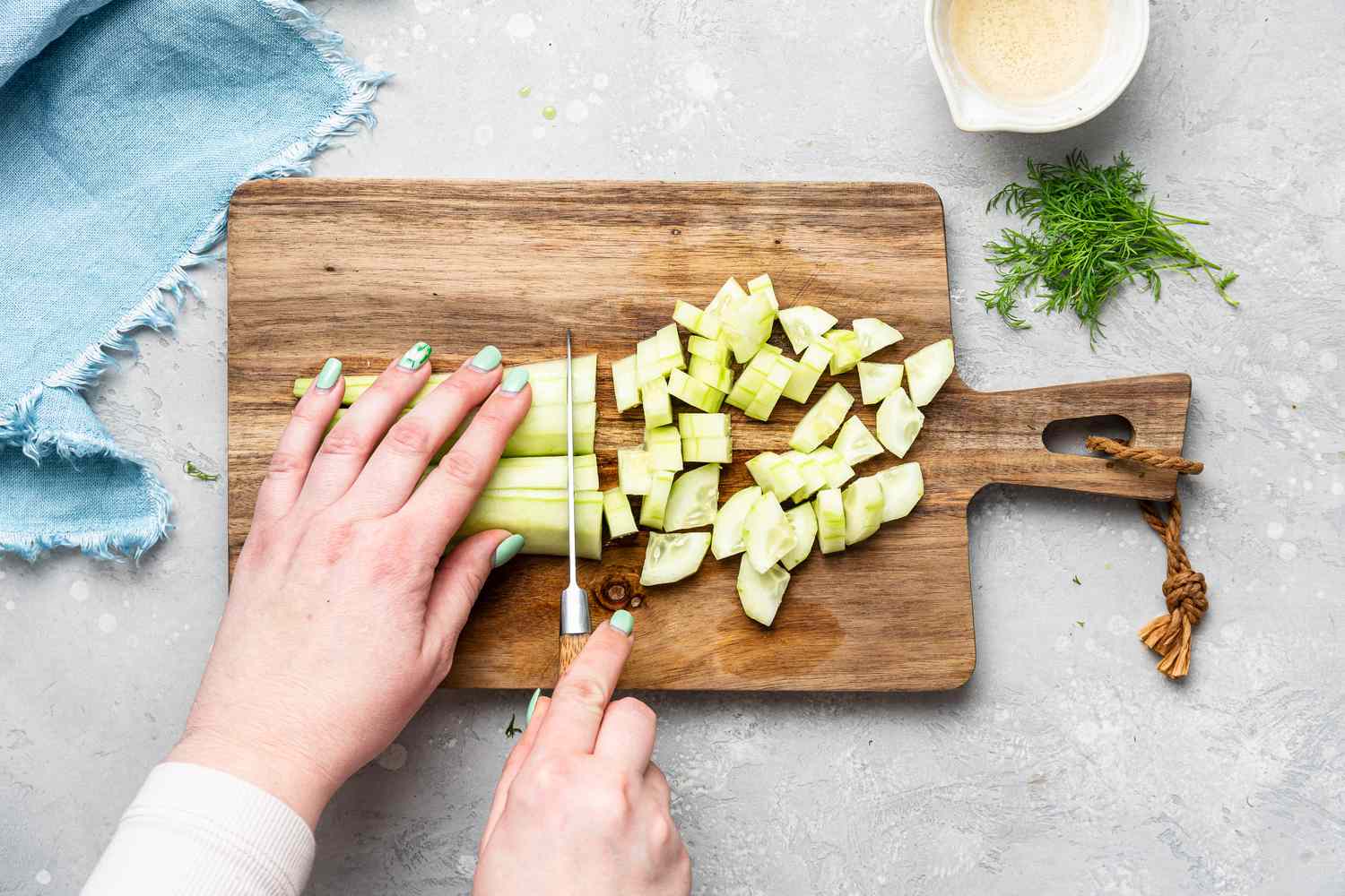 Chopping cucumbers for Cucumber Salad