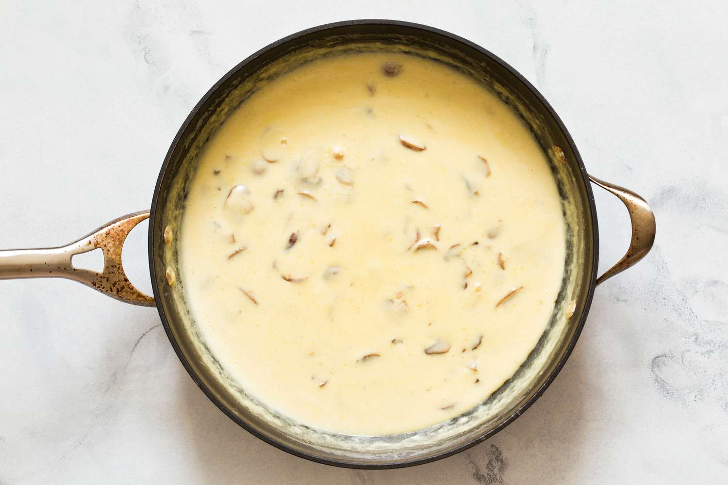 Overhead view of a saucepan with the sauce for Chicken Tetrazzini Casserole recipe