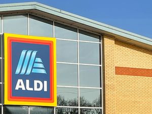 Aldi storefront showing the store sign and part of the building