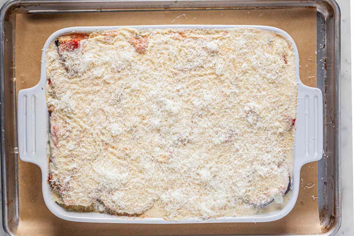 Assemble vegetarian moussaka in casserole