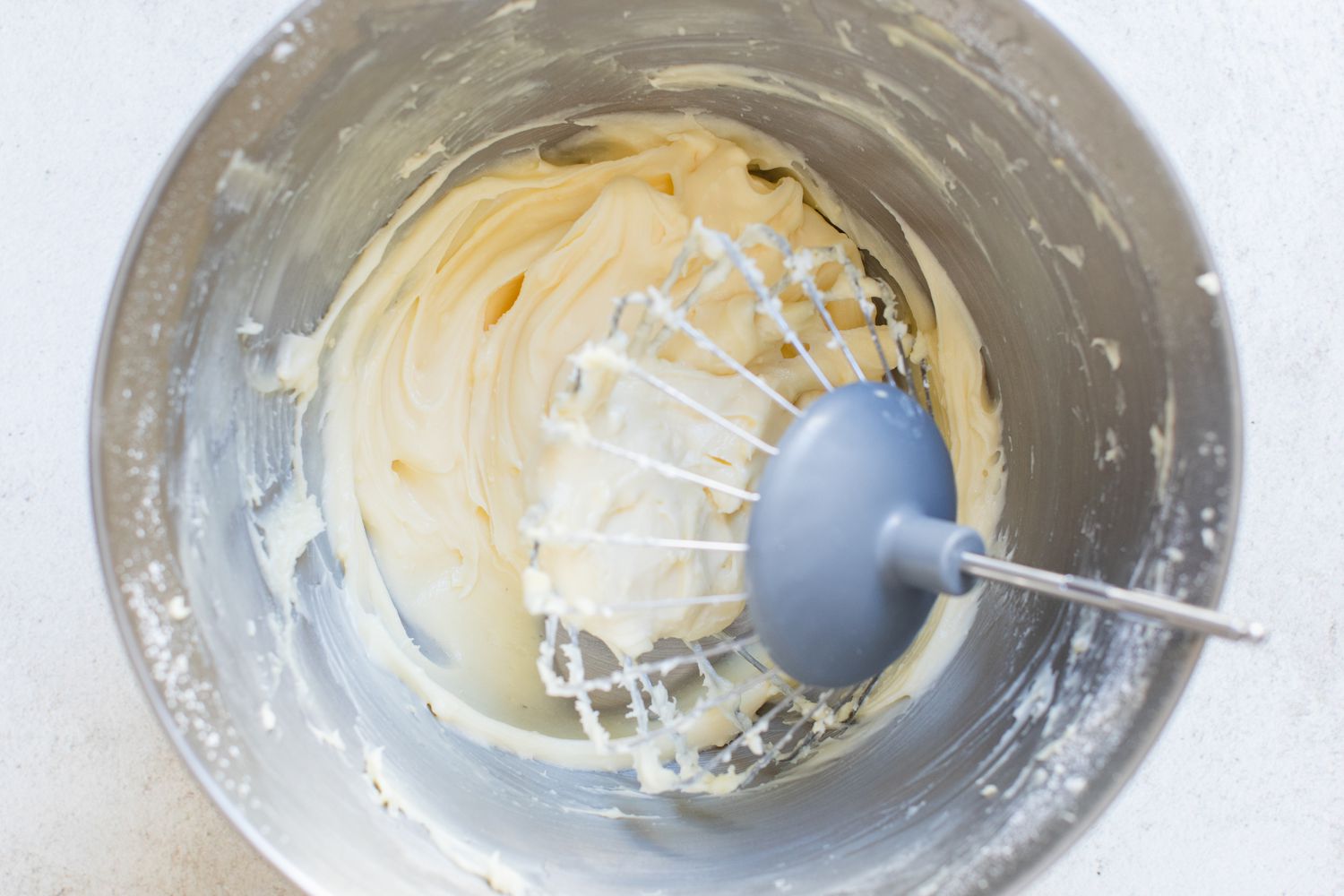 Cream Cheese Frosting in a Mixer Bowl for Banana Sheet Cake Recipe