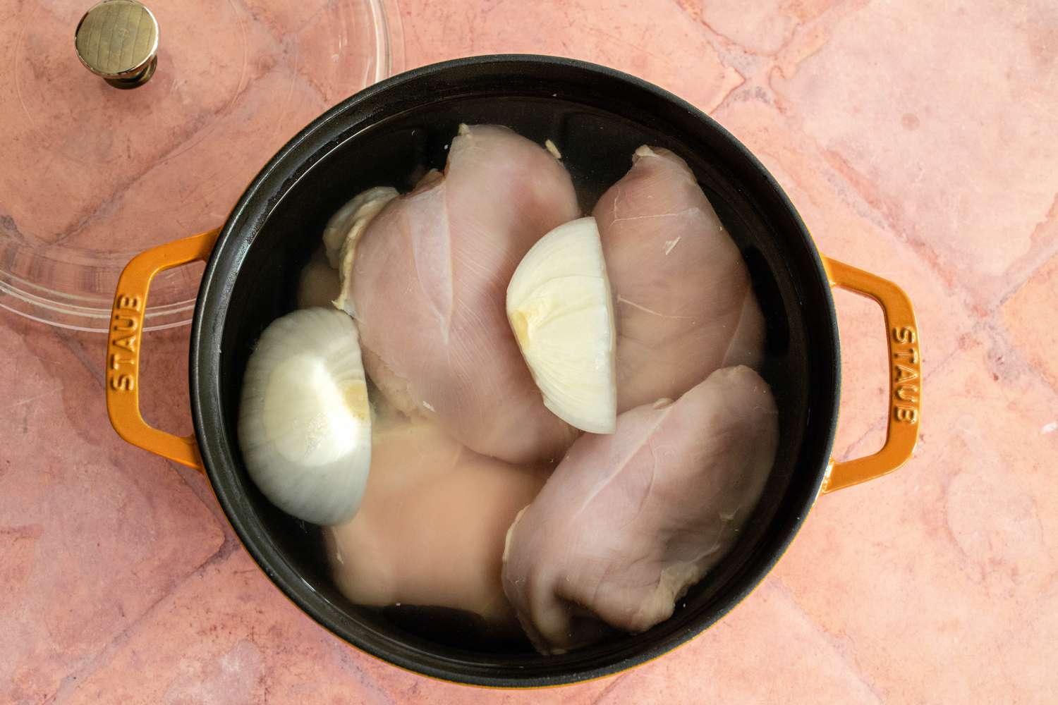 Chicken Breast and Onions in a Dutch Oven Filled with Water for Chicken Tamales with Chile Verde Recipe