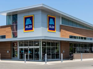 A standalone Aldi grocery store building with signs