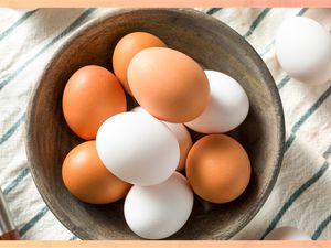 Brown eggs and white eggs in a bowl