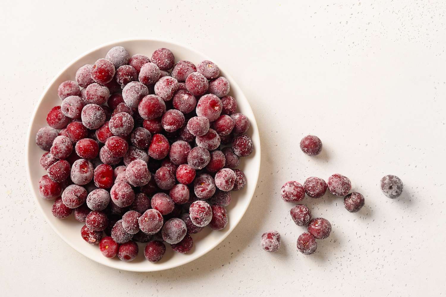 overhead view of a bowl of frozen cherries