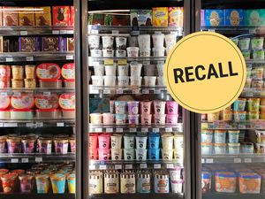 Freezers stocked with various brands of ice cream with a yellow recall badge overlay
