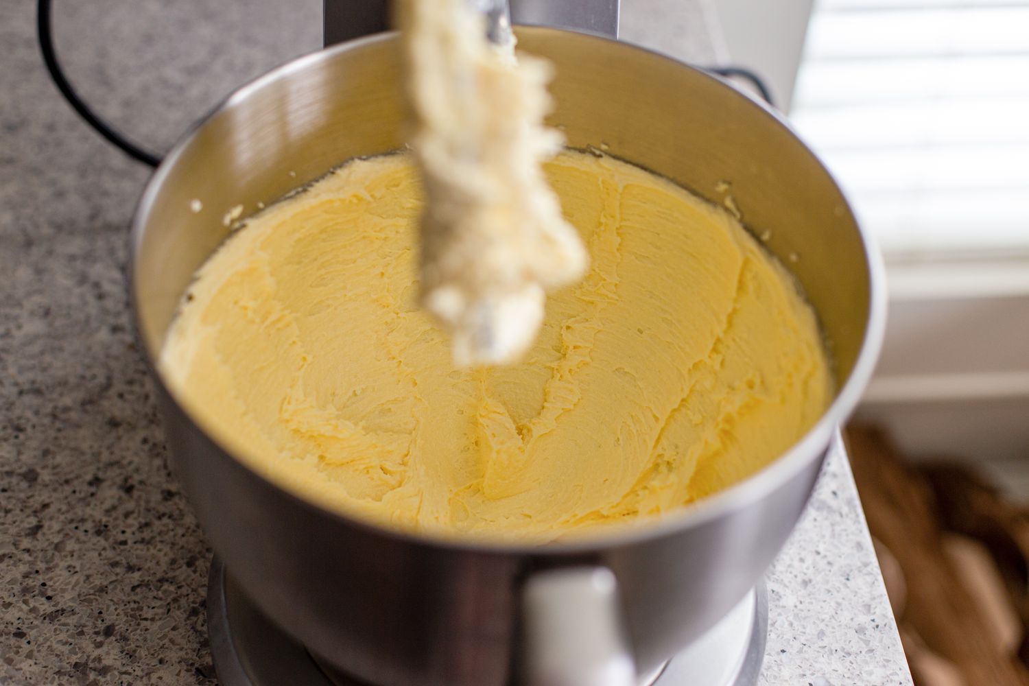 Creaming butte and sugar to make marzipan stamped cookies.