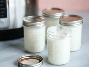 Homemade Yogurt resting in four jars
