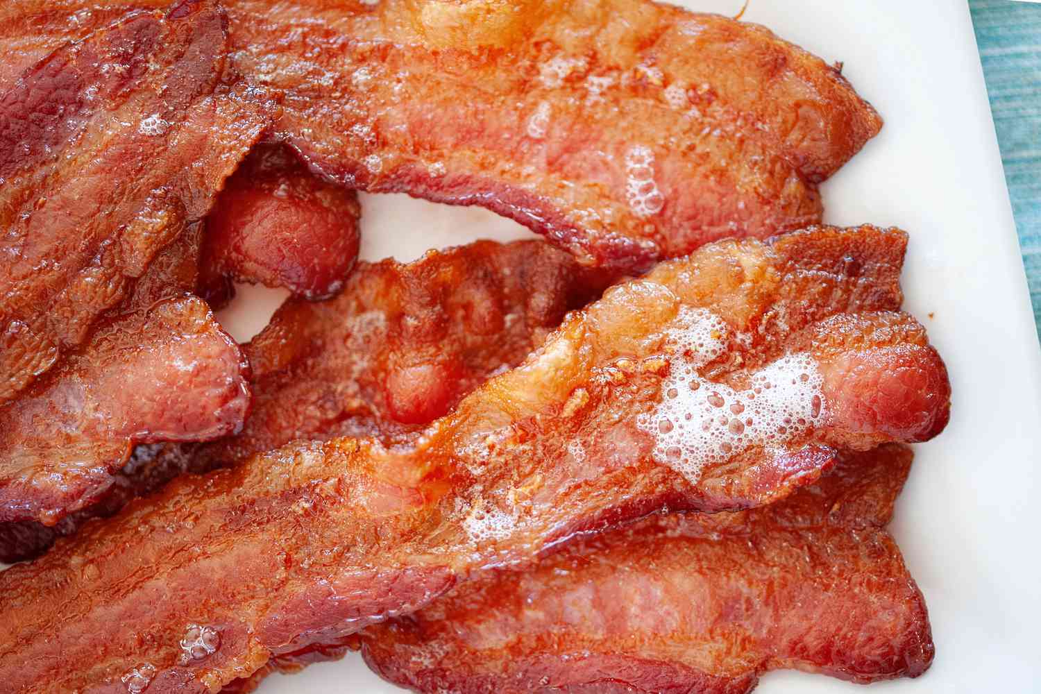 Cooking bacon in the oven and set on paper towels.