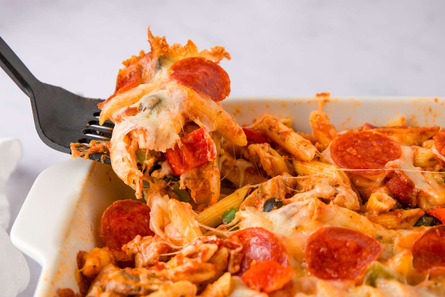 Scoop of pizza casserole.