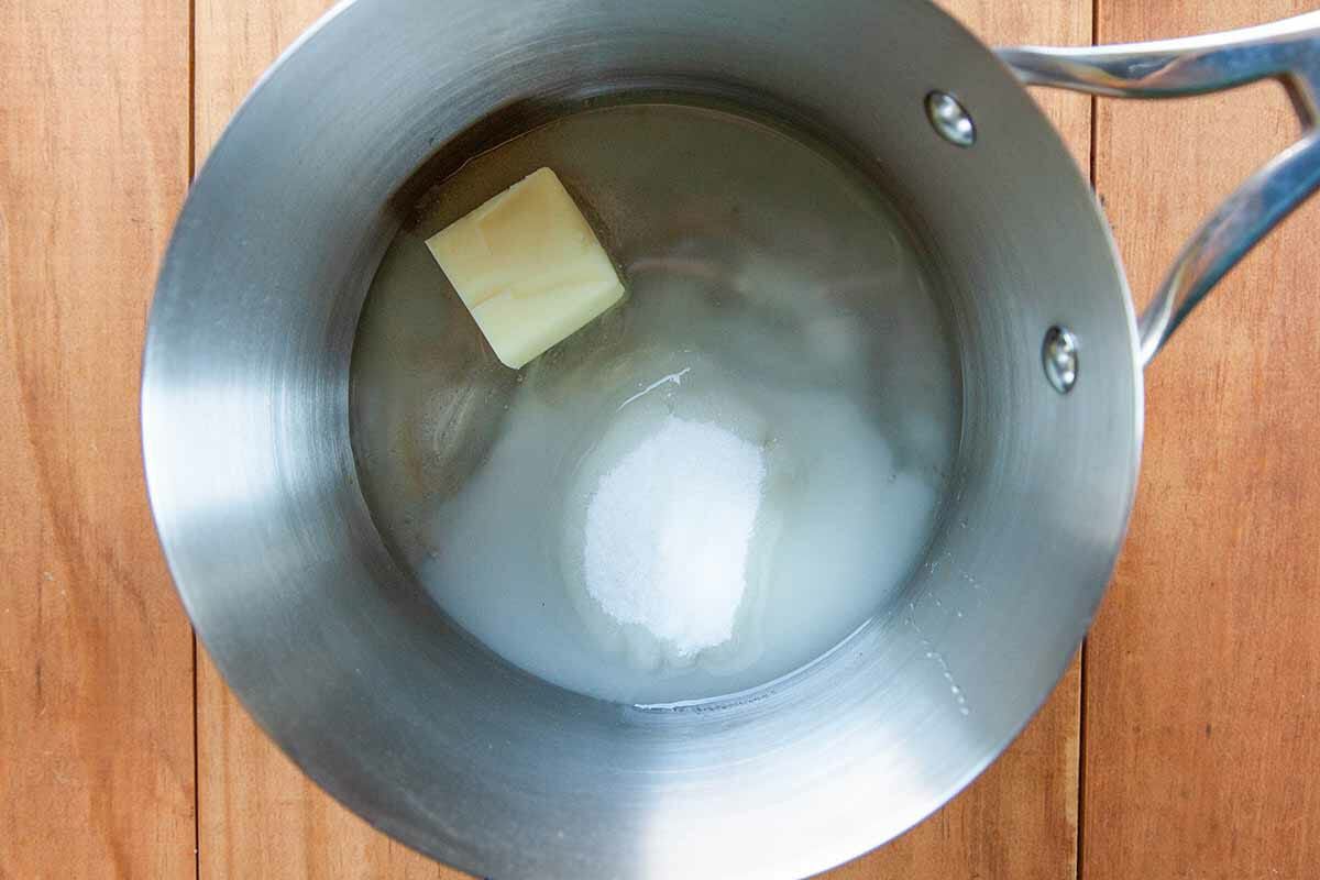 Old Fashioned Peanut Brittle Recipe melt the butter with water, sugar, butter, and corn syrup