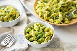 Bowls of Green Goddess Pasta Salad with a Bigger Bowl in the Background