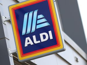 Sign for an Aldi store on the exterior of a building