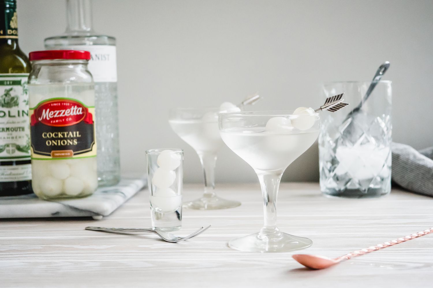 Gibson Cocktail with Pickled Onion Garnish and in the Background, Ingredients for the Cocktail