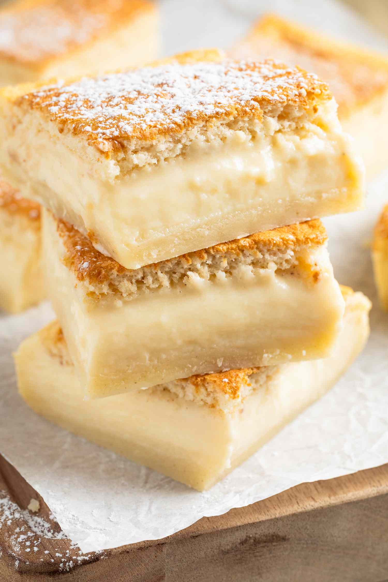 magic cake slices stacked a piece of parchment paper on the counter