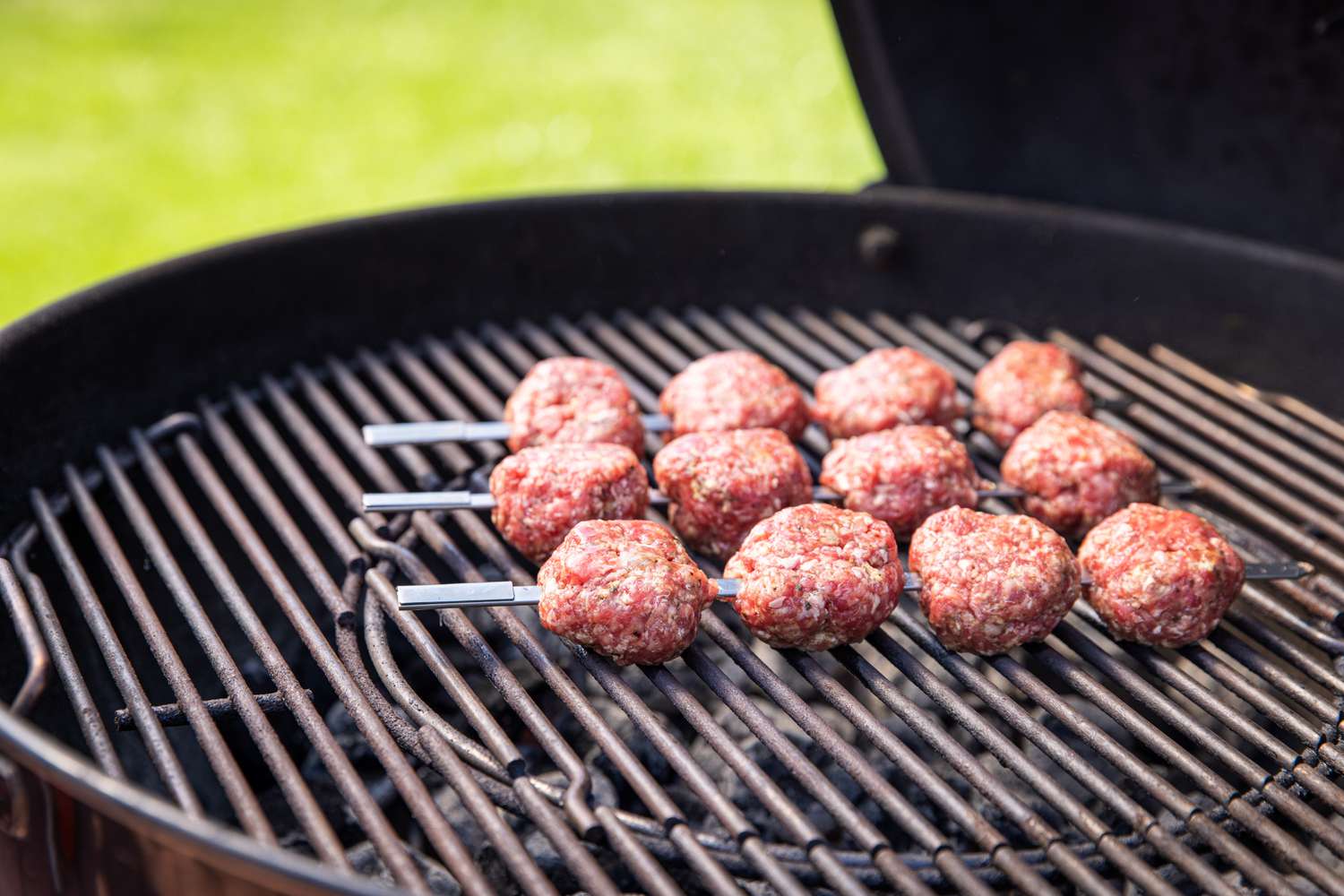 Skewered Greek Meatballs Cooking on a Grill