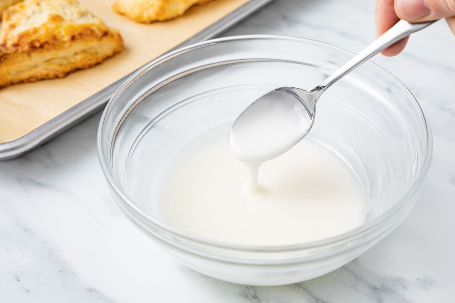 Lemon Glaze in Bowl with a Spoon for Scones Recipe