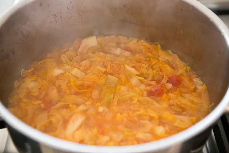 Simmering cabbage soup on stovetop