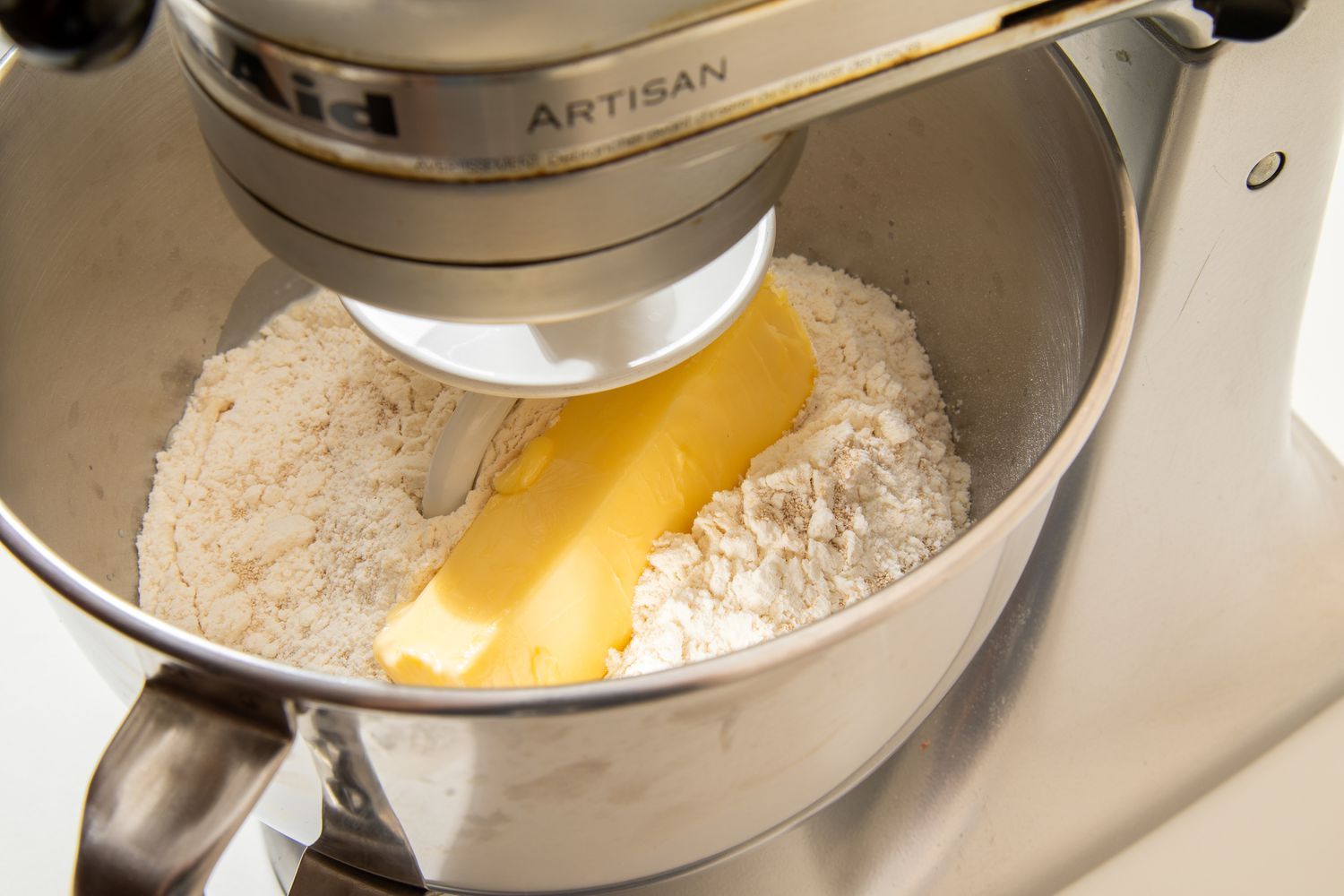 The rest of the dough ingredients added to the mixer bowl on the stand mixer for salted honey rolls recipe