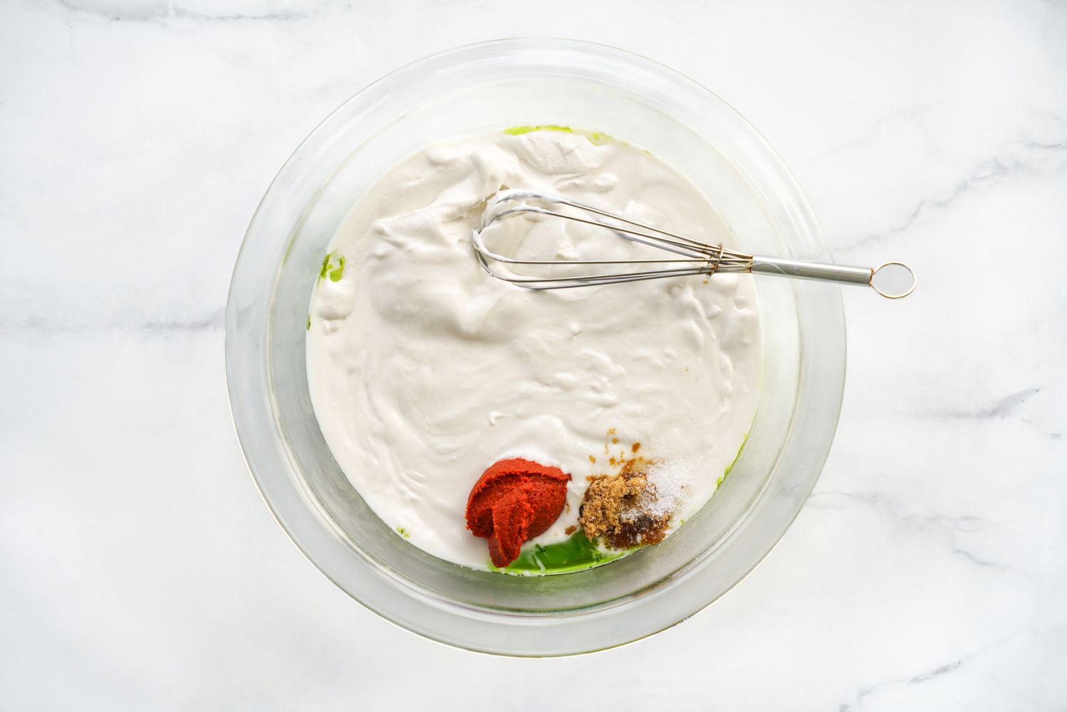 Coconut milk, Curry paste, and Brown Sugar Added to Bowl of Aromatic Oil for Microwave Red Curry Salmon Recipe
