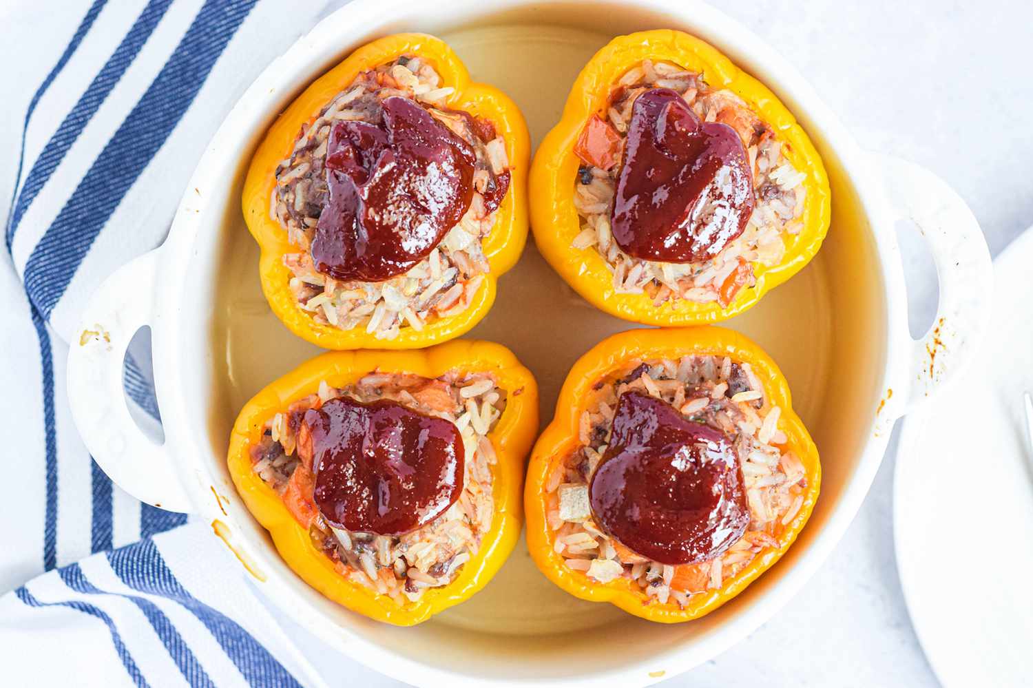 Checking the temperature of baked stuffed peppers.