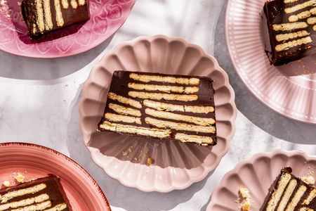Overhead shot of pink plates with slices of German hedgehog slice cake