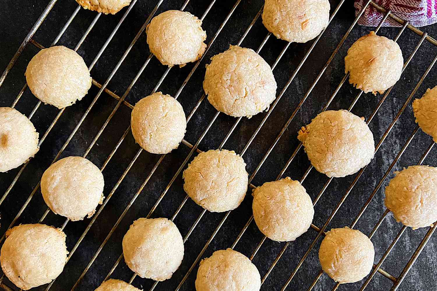 Homemade cheese puffs resting on an oven rack