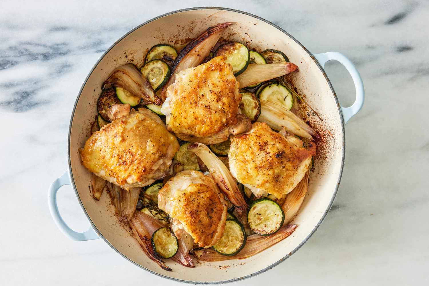 crispy chicken thighs with zucchini and shallots in a dutch oven (baked)