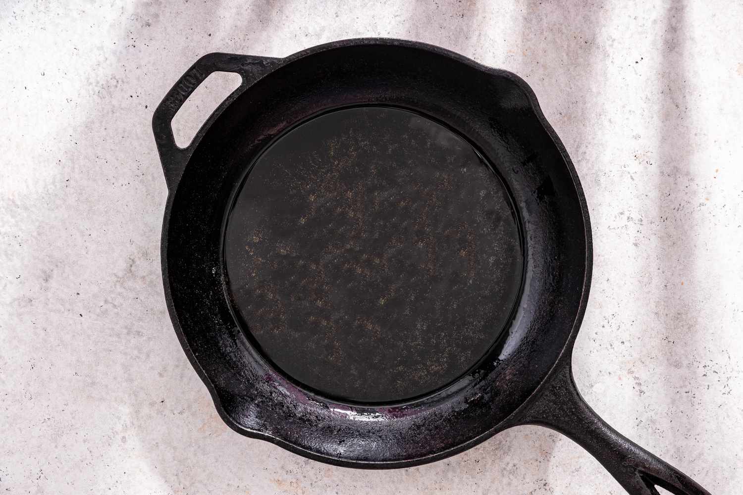 Cast Iron Skillet With Olive Oil for Zucchini Butter Recipe