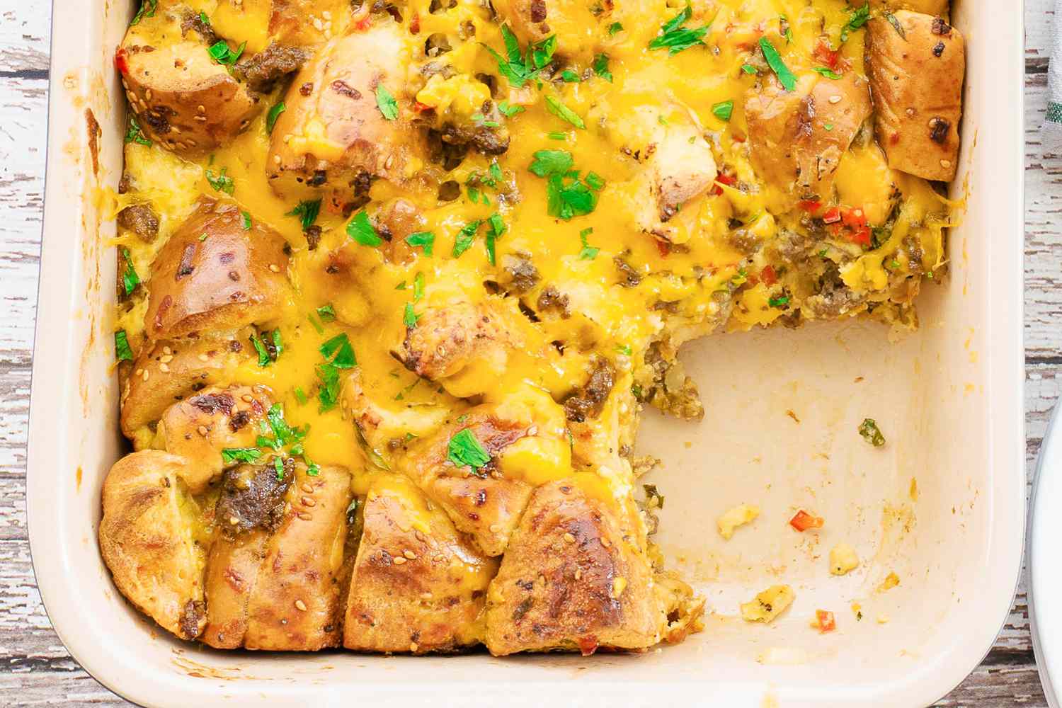 Close up shot of bagel casserole with a slice taken out