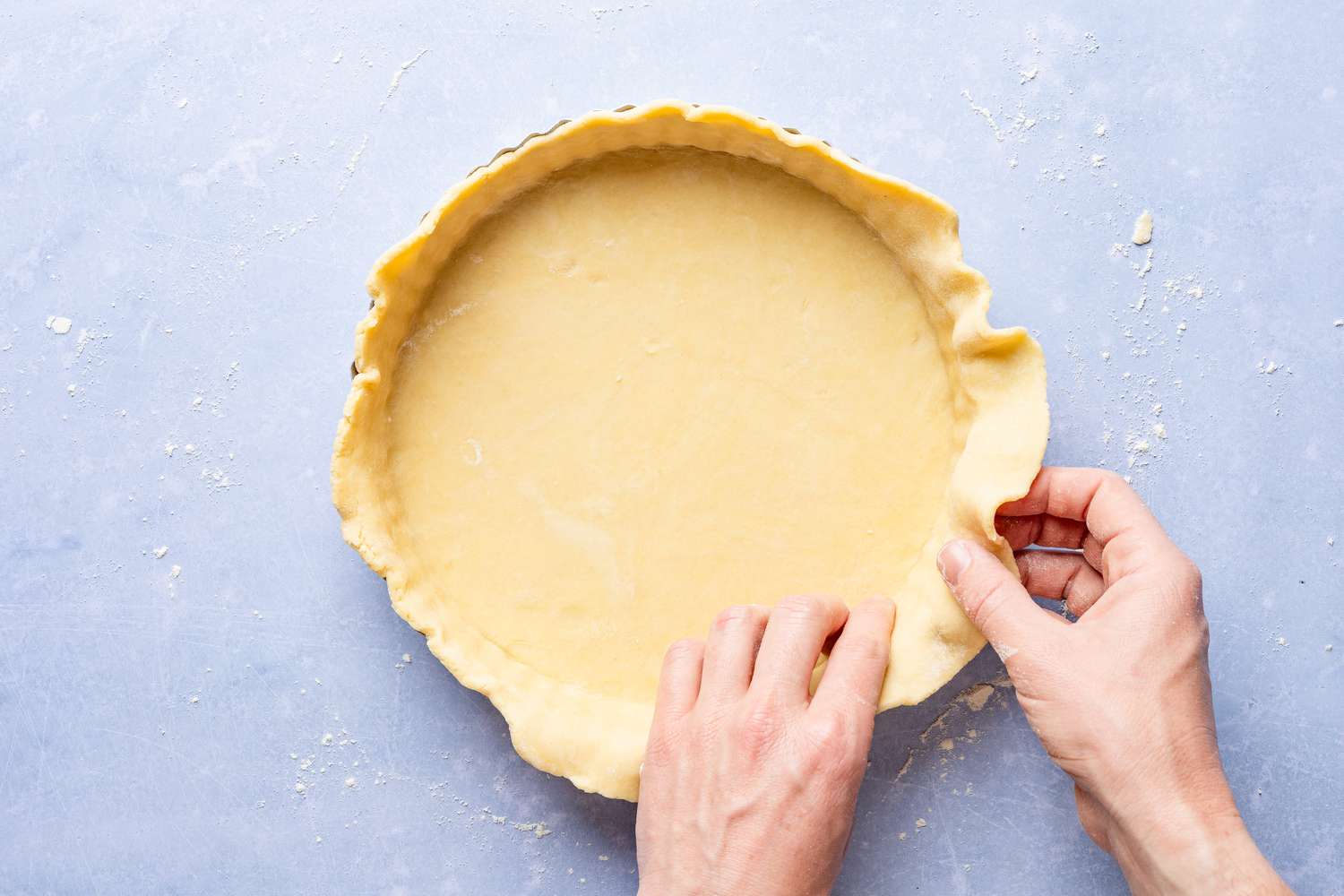 shortcrust pastry added and shaped into a tart pan for cornflake tart recipe 